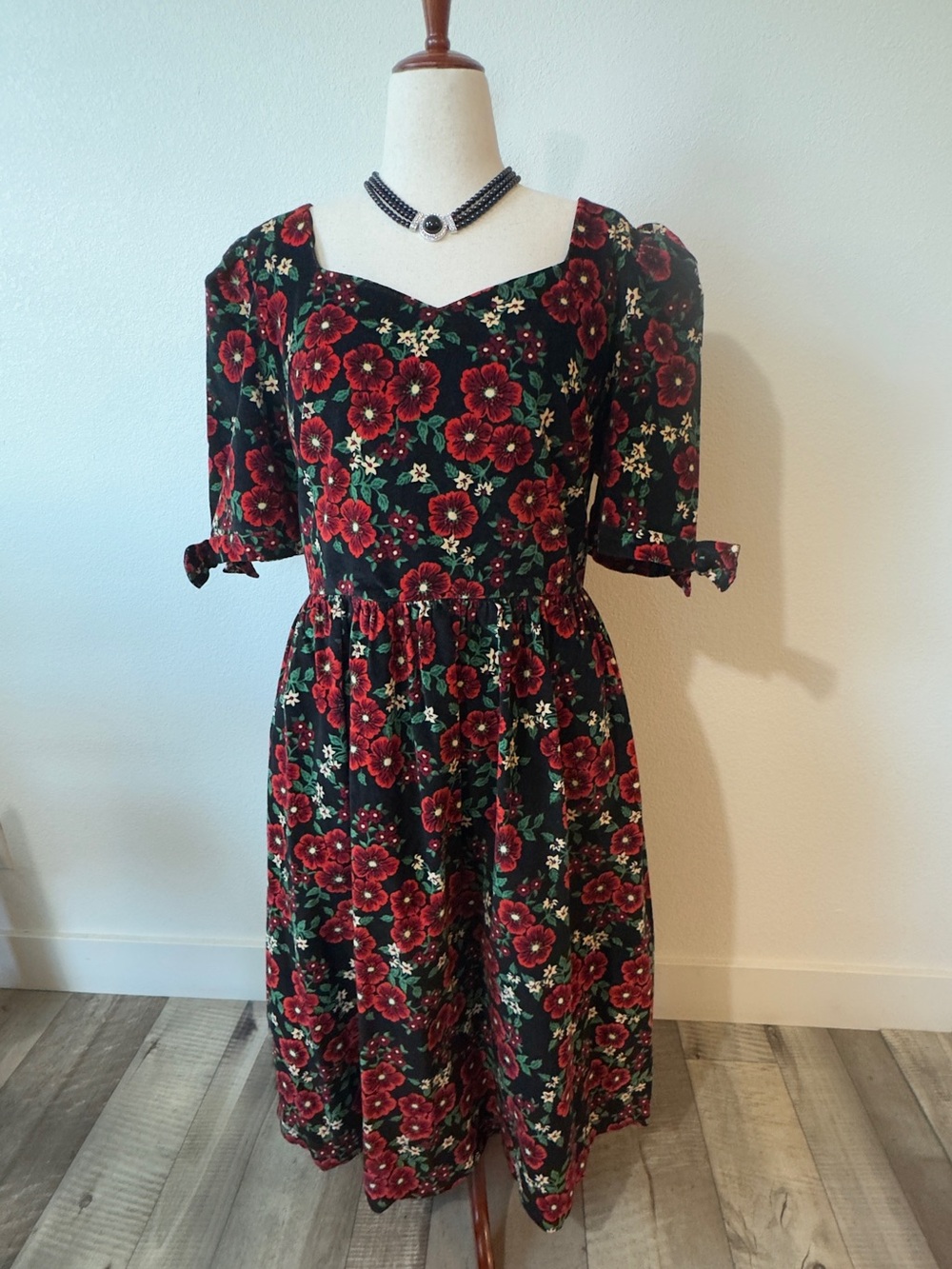 Vintage-Inspired Black Midi Dress with Red Floral Print